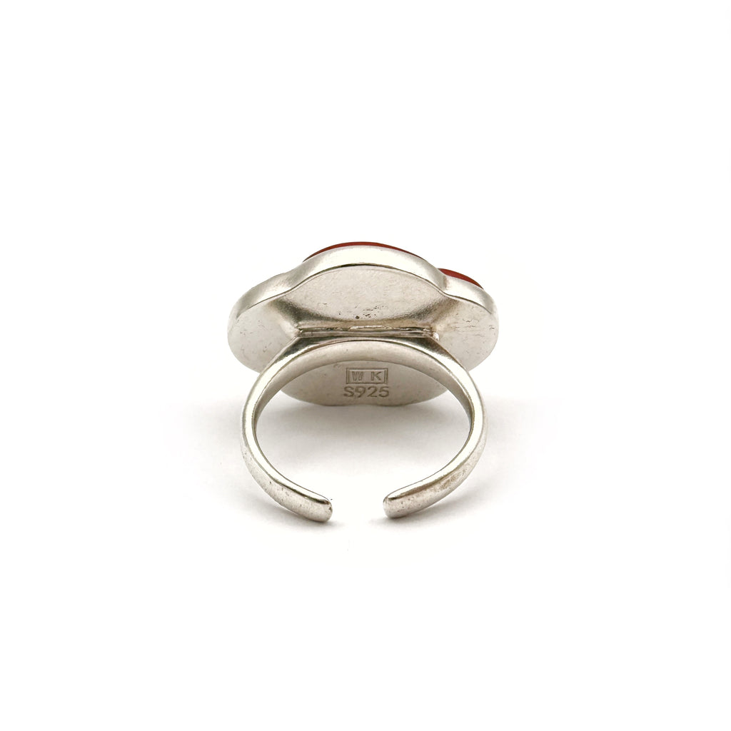 Red Peach Lacquer Quasi-Maki-e Blossom Ring — Silver ring with a leaf design on a white background