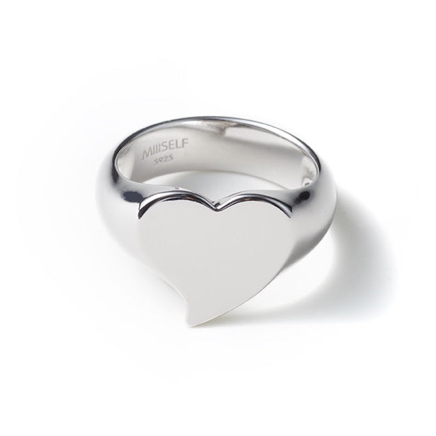 Silver Heart Signet Ring — Silver heart-shaped ring on a white background
