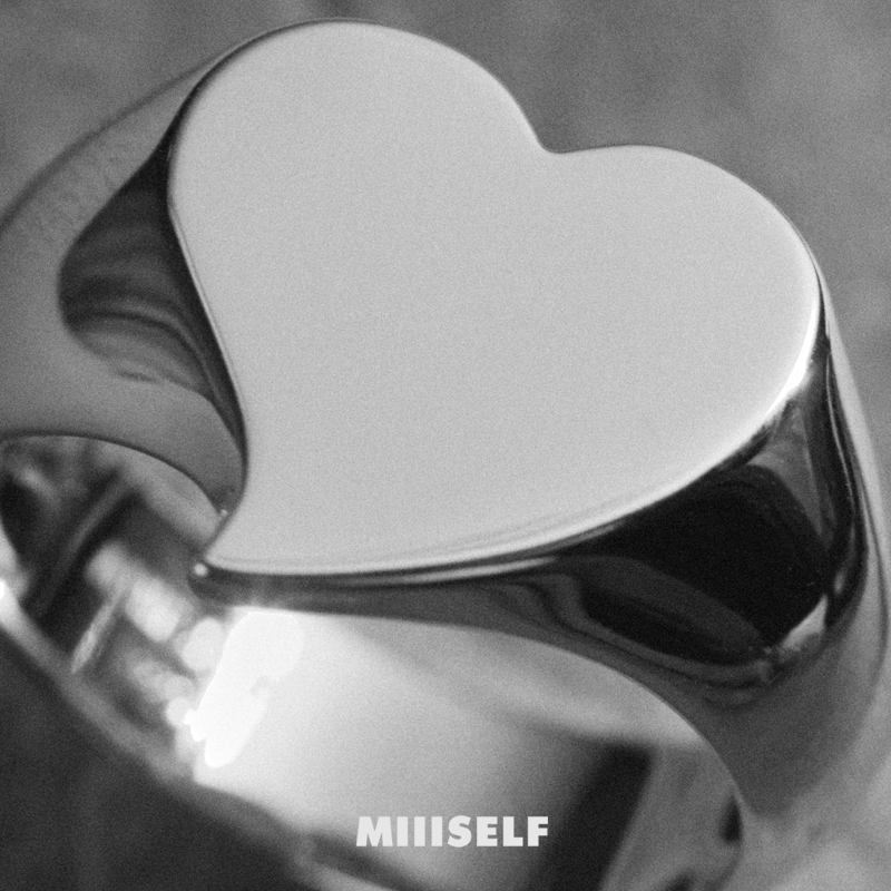 Silver Heart Signet Ring — Heart-shaped object with 'MIIISELF' branding on a gray background