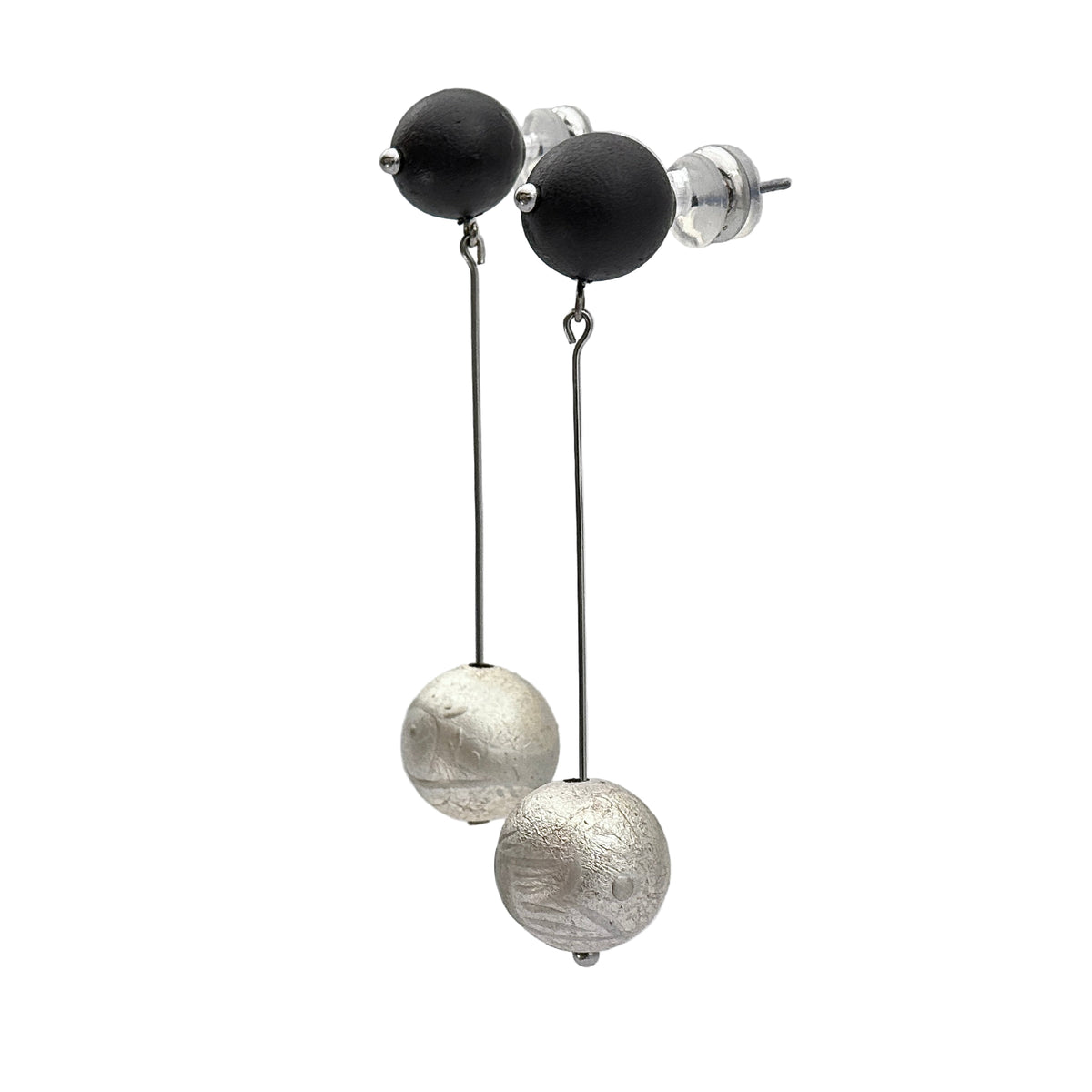 Silverfish Lacquer Quasi-Maki-e Earrings — Black and silver earrings on a white stand