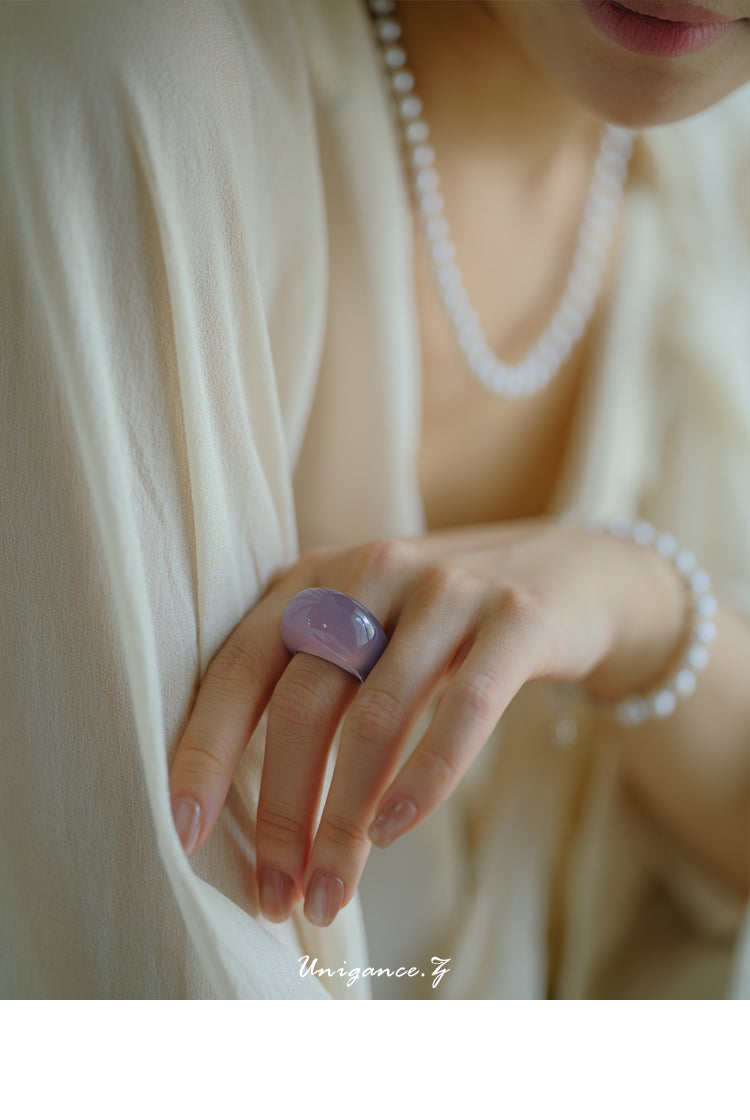 Smoky Purple Jade Band Ring — Close-up of a hand wearing a ring with a blurred background
