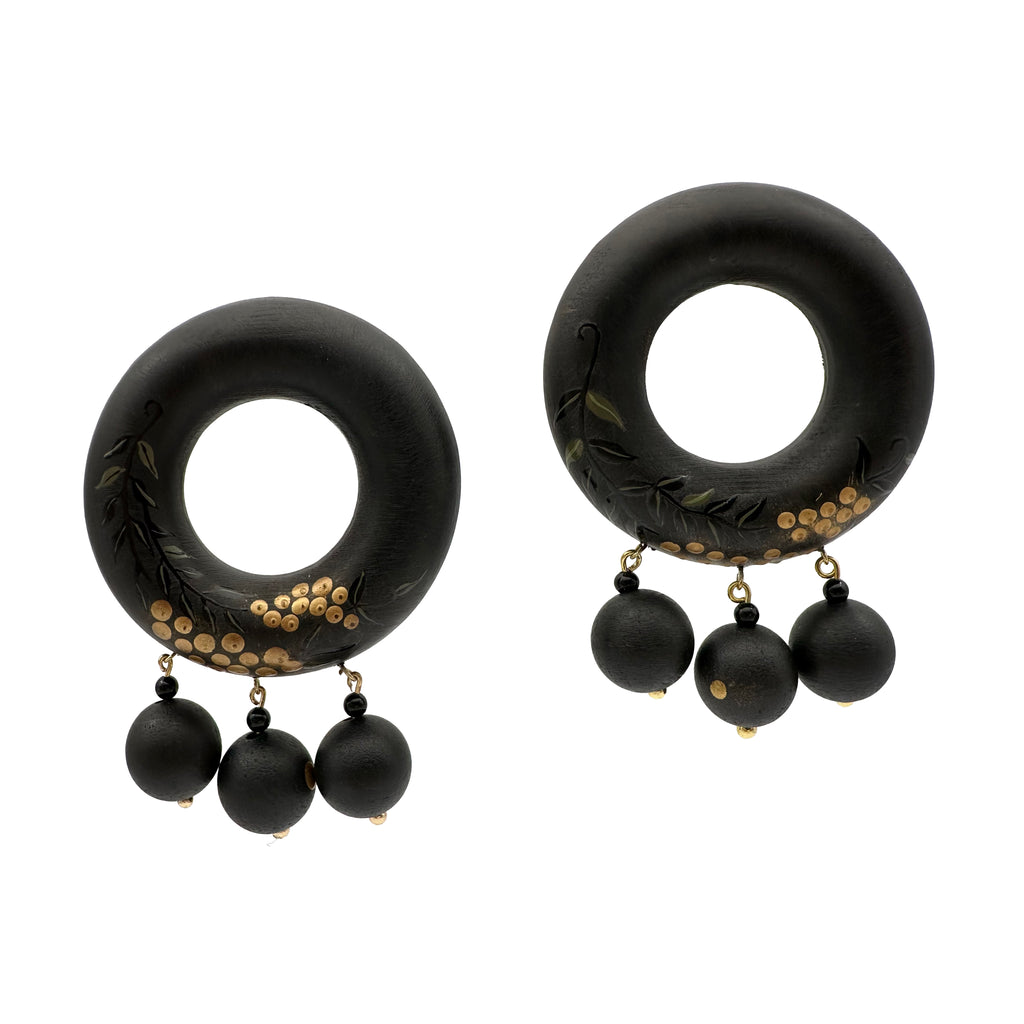 Tenjiku Black Lacquer Drop Earrings — Black hoop earrings with gold accents and black beads on a white background