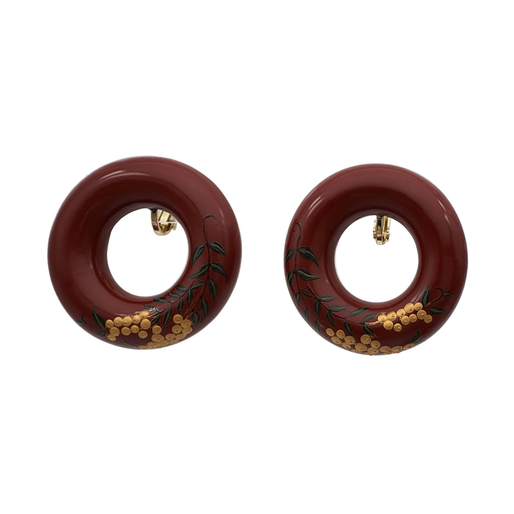 Tenjiku Red Lacquer Quasi-Maki-e Earrings — Pair of round earrings with decorative design on a white background