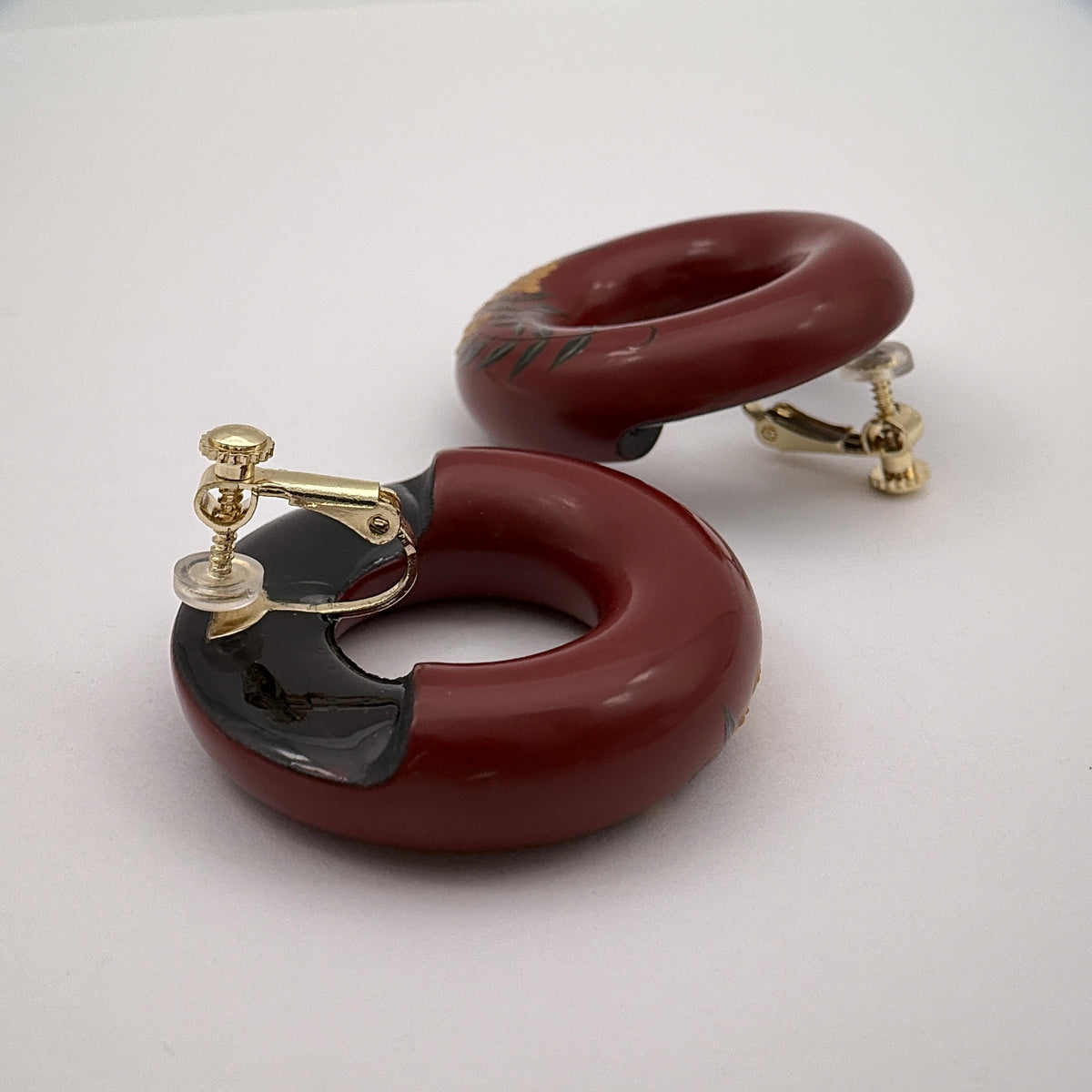 Tenjiku Red Lacquer Quasi-Maki-e Earrings — Pair of red daqi earing on a white background