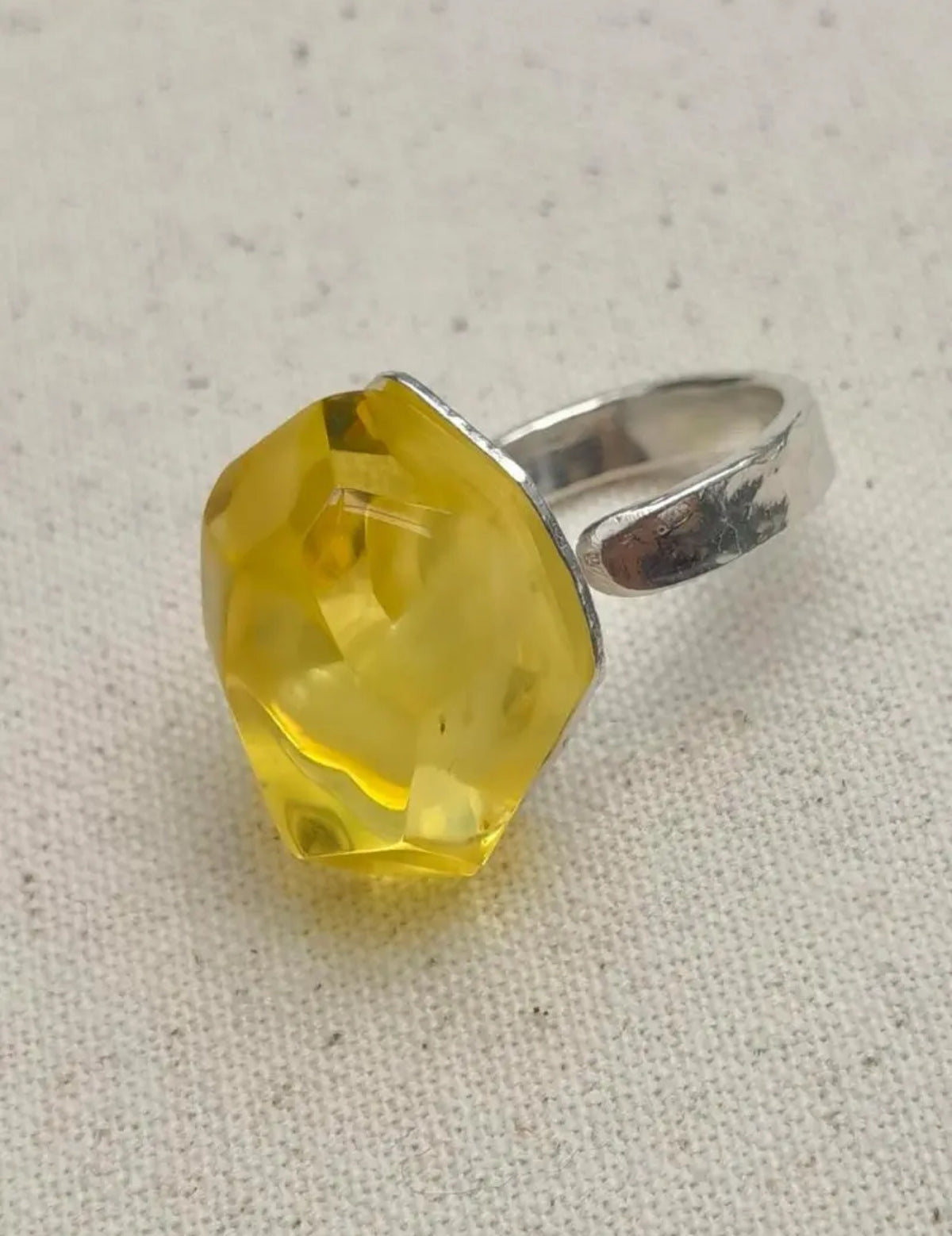 Time Capsule · Golden Amber &amp; Hammered Silver Adjustable Ring — Ring with a yellow gemstone and silver band on a textured