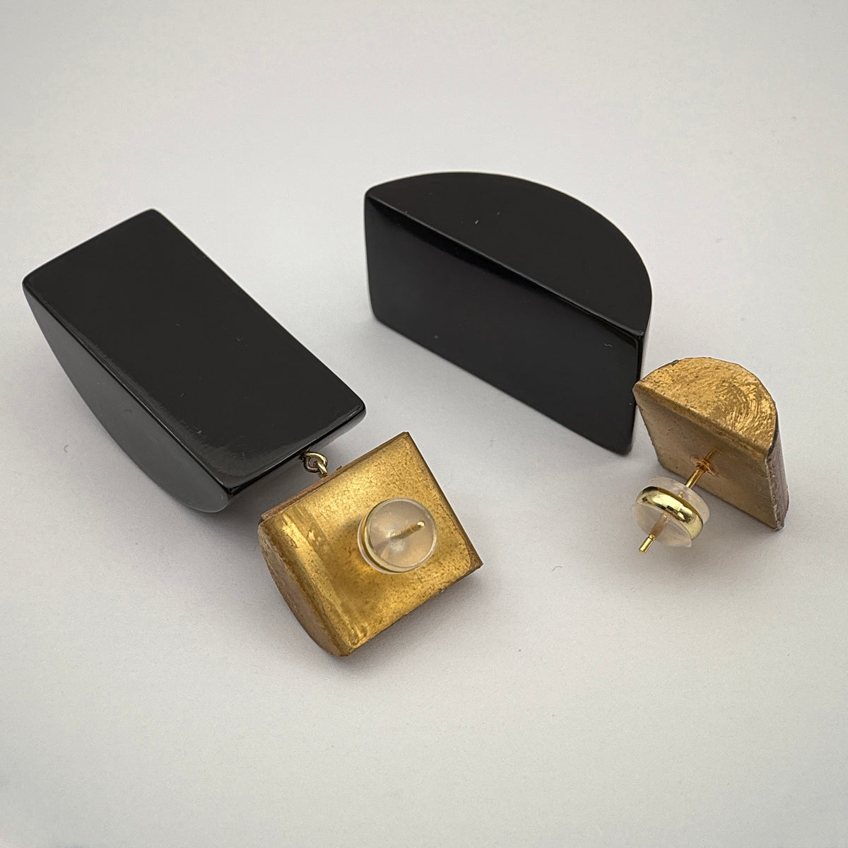 Tranquil Bamboo Lacquer Quasi-Maki-e Earrings — Gold and black geometric earrings on a white background