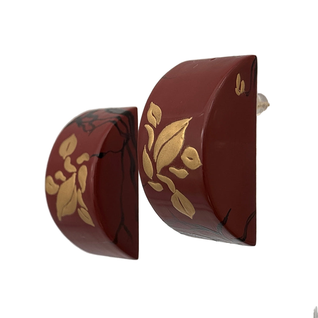 Tranquil Magnolia Lacquer Quasi-Maki-e Earrings — Red earrings with gold floral patterns on a white background