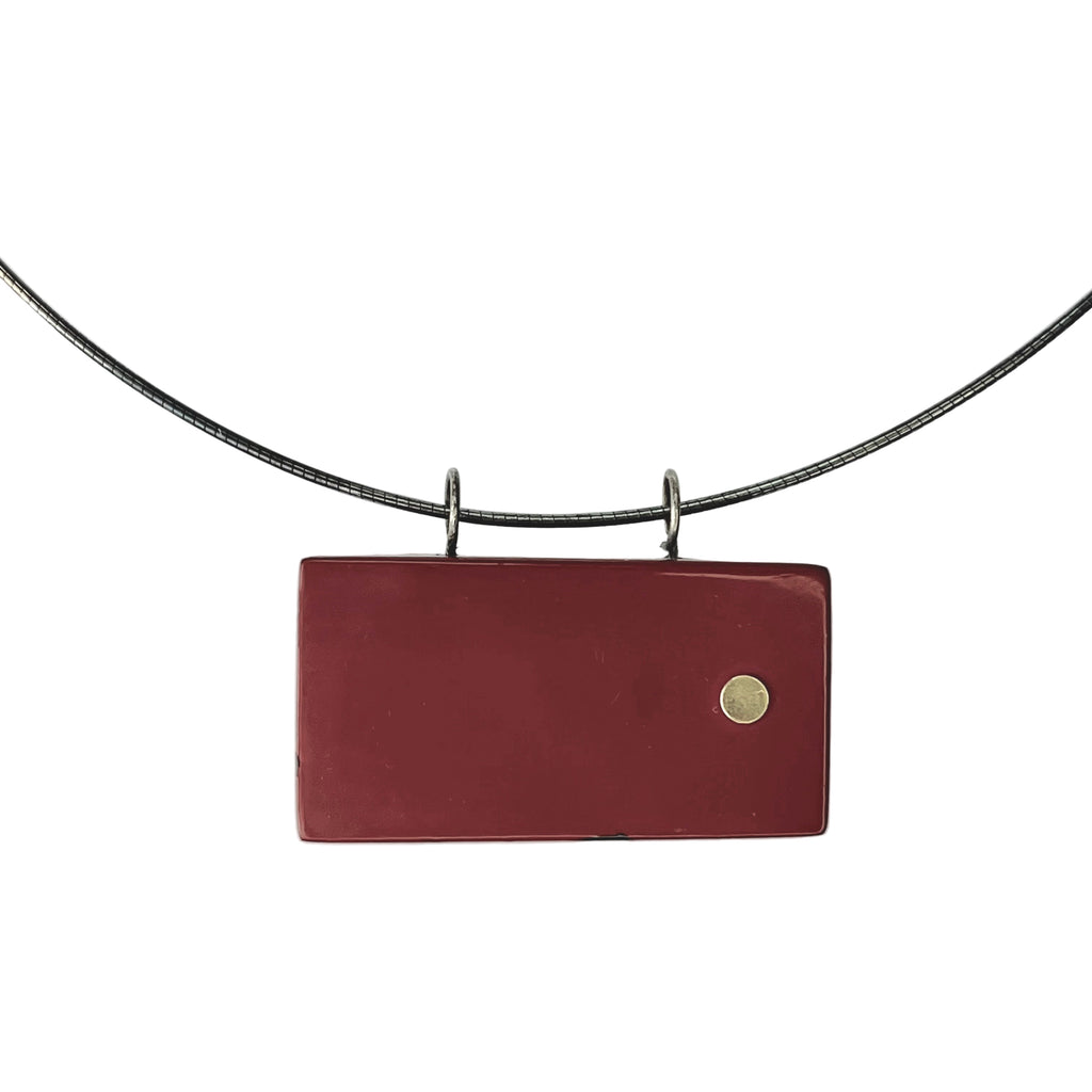 Tranquil Magnolia Lacquer Quasi-Maki-e Necklace — Red leather wallet with a gold button on a white background