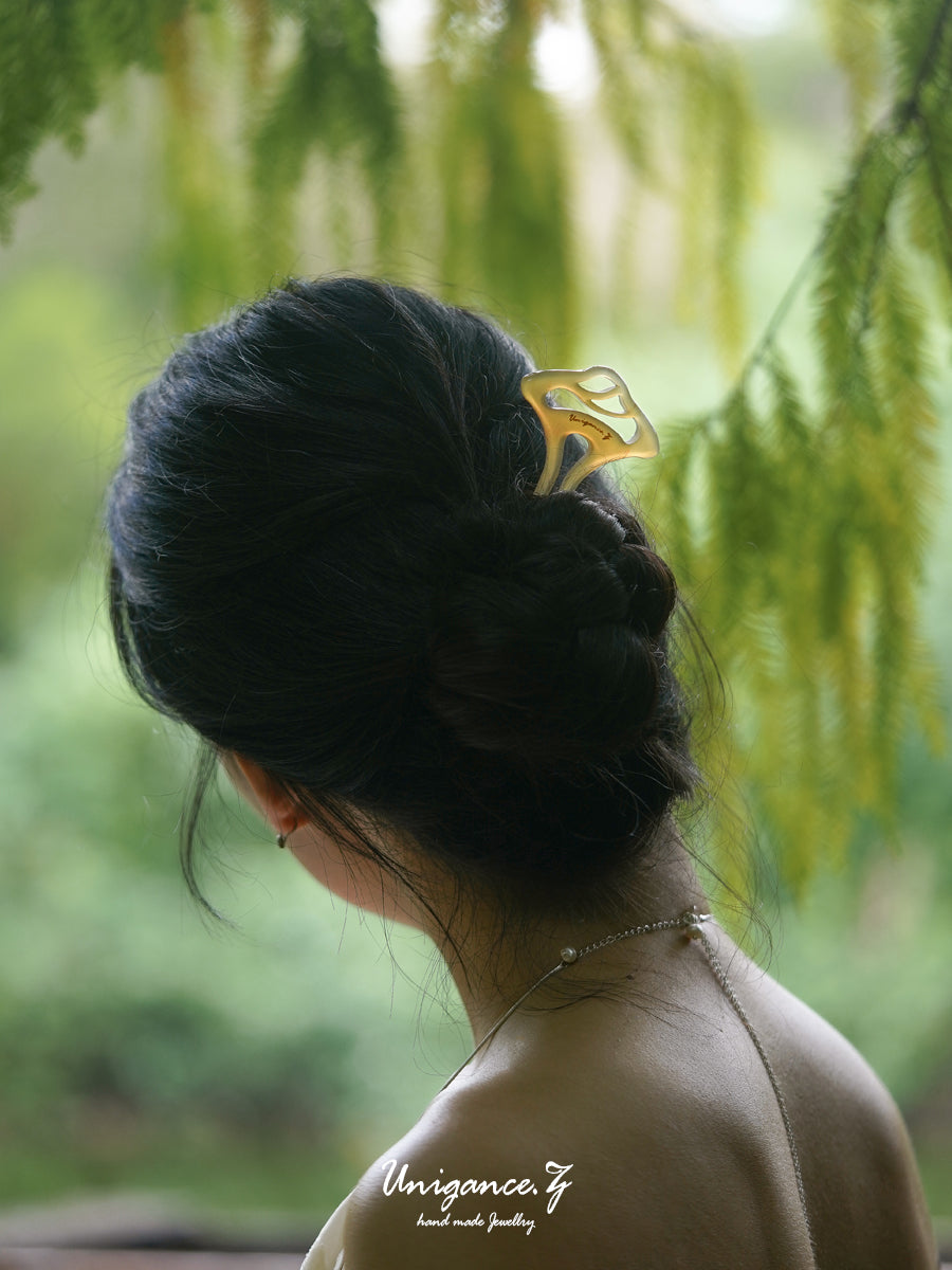 Welcoming Pine Hairpin — Person with braided hair wearing a yellow hair clip in a natural setting